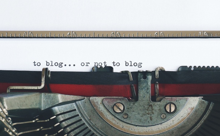 A typewriter. Someone has written 'To blog... or not to blog'.