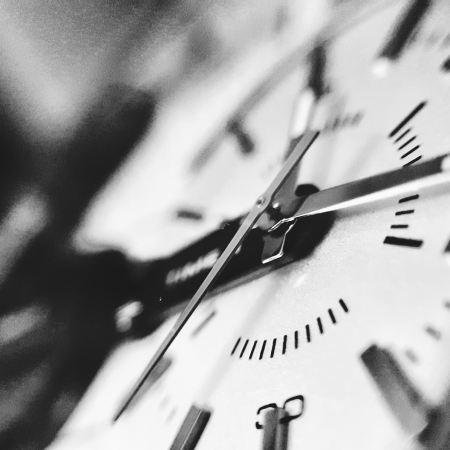 Black and white close-up of a watch face. Image from Noor Younis | unsplash.com